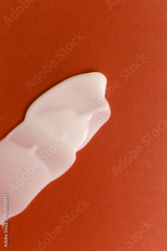 Cosmetic cream texture on neutral background