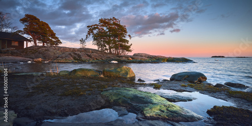 фотографія March evening on the banks of the Kallahdenniemi stones pine trees sunset