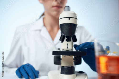 Fototapeta Naklejka Na Ścianę i Meble -  woman scientist laboratory microscope diagnostics chemical solution analyzes