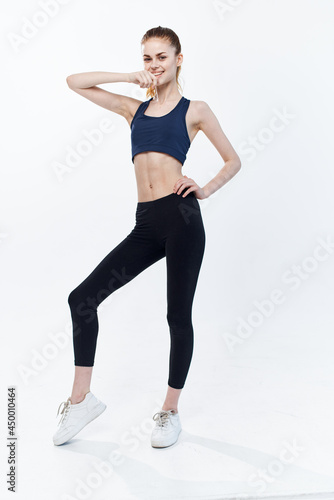 sportive woman cardio workout exercise posing light background © SHOTPRIME STUDIO