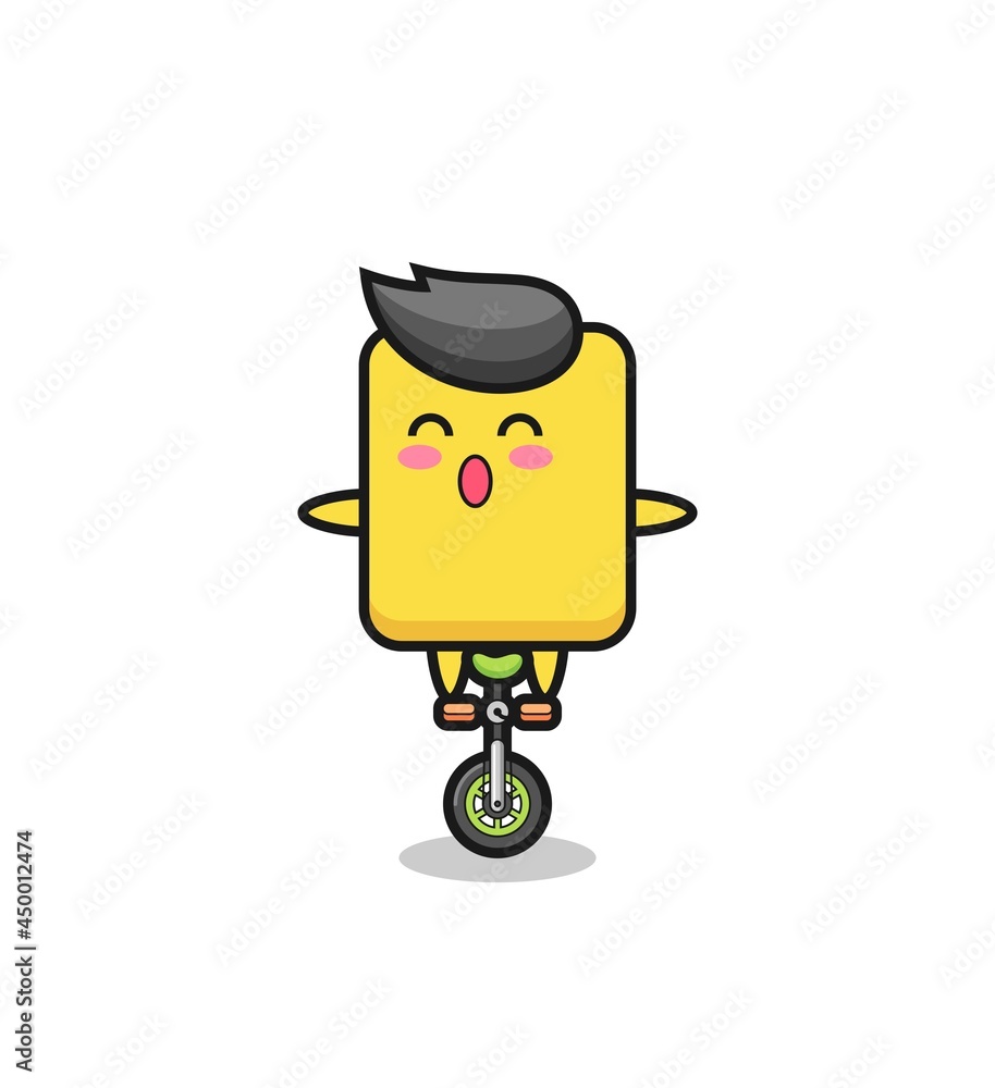 The cute yellow card character is riding a circus bike The cute yellow card character is riding a circus bike