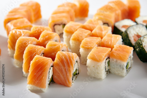 Sushi Rolls Set with Various Salmon Maki Rolls. Maki sushi rolls on white background.
