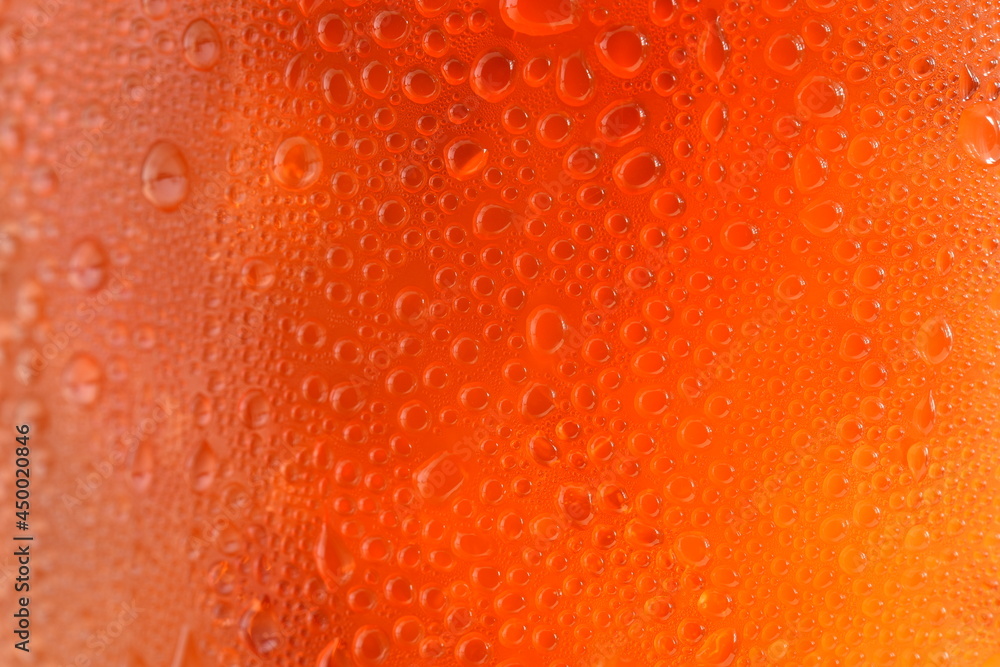 Black drop of orange-yellow water droplets Black drop of orange-yellow water droplets