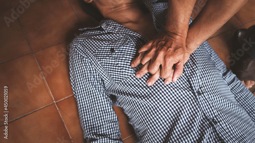 Doing CPR first aid to man with heart attack part of the resuscitation process, Close up shot with vintage picture style.