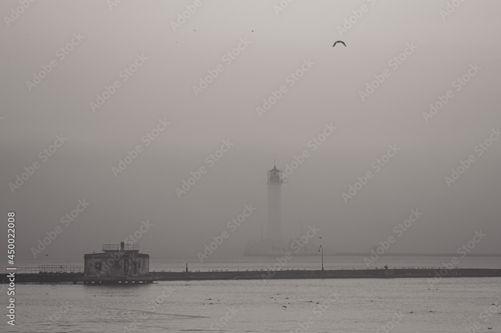 Lighthouse in a morning fog in Odessa