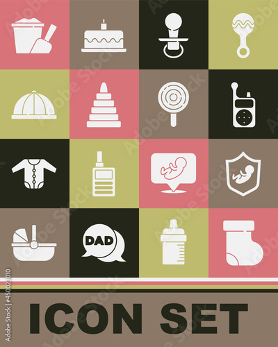 Set Baby socks clothes, on shield, Monitor Walkie Talkie, dummy pacifier, Pyramid toy, hat, Sand in bucket with shovel and Lollipop icon. Vector
