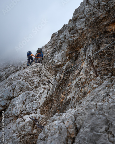 climbing couple in the Höllental via ferrata on their way to the Zugspitze, top of Germany