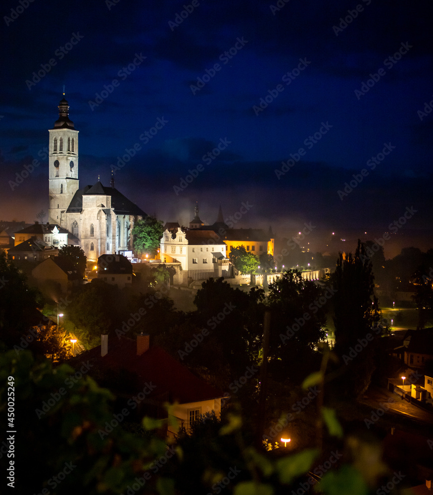 Landscape or cityscape Picture of Kutna hora town with Saint James church, full of historic buildings from ancient age in gothic style during sunset in spring, world heritage of Unesco. Czech Republic