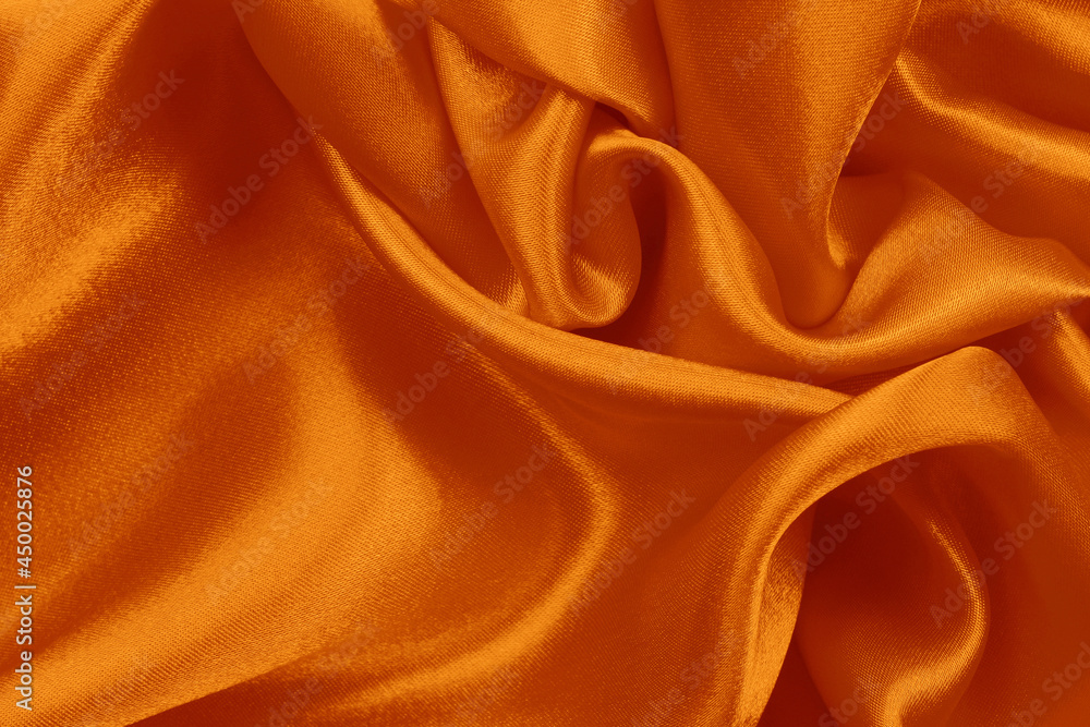 Fototapeta premium Orange fabric texture background, detail of silk or linen pattern.