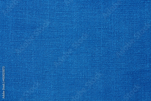 Blue linen fabric cloth texture for background, natural textile pattern.