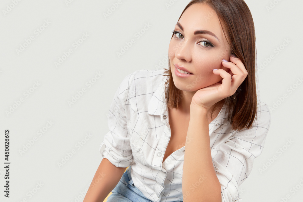 Beautiful woman in casual clothes posing over white background Beautiful woman in casual clothes posing over white background