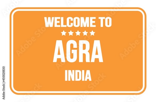 WELCOME TO AGRA - INDIA, words written on orange street sign stamp