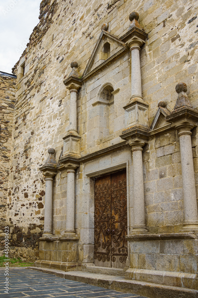 Main facade in Renaissance style of Mare de Deu dels Angels church in Llivia, Catalonia, Spain.