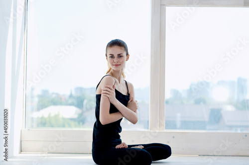 Free Download woman meditates on windowsill near window workout exercise - GFXLoad