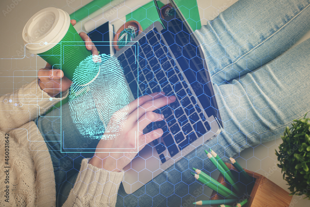 Double exposure of woman hands typing on computer and fingerprint drawing. Security concept. Double exposure of woman hands typing on computer and fingerprint drawing. Security concept.