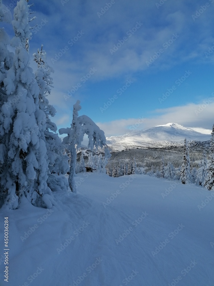 Skiing in the beautiful sunny and snowy weather in Åre Mountains Ski Resort in Sweden