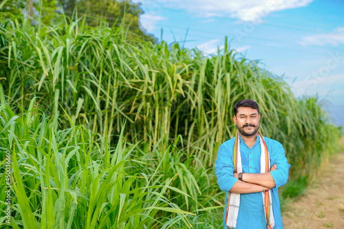 indian farmer at sugarcane field