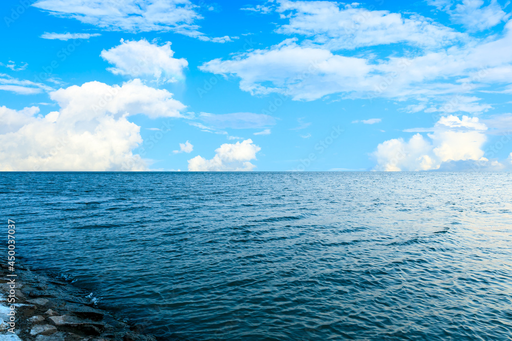 Fototapeta premium Outdoor tranquil water surface and sky natural landscape in summer, Asia