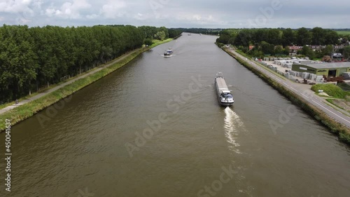 Container cargo ship at Amsterdams Rijn Canal in the Netherlands photo