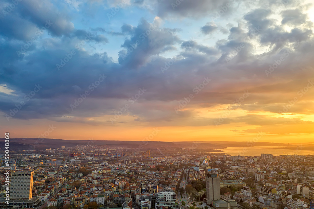 Amazing colorful clouds at sunset over the city. Varna, Bulgaria