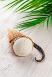 vanilla ice cream in a cone on a white background