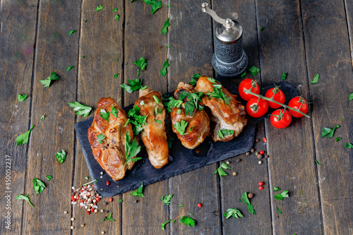 Lamb Meat On Black Board With Spices And Tomatoes On Wooden Background.