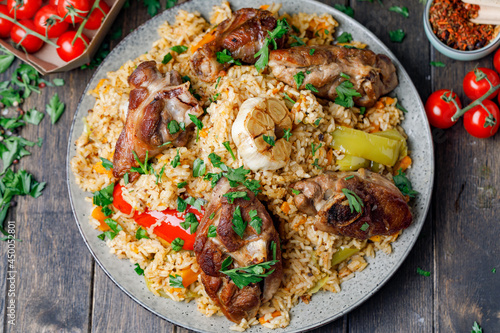 Traditional Pilaf With Lamb, Vegetables, Spices On Wooden Background. Flat Lay. photo