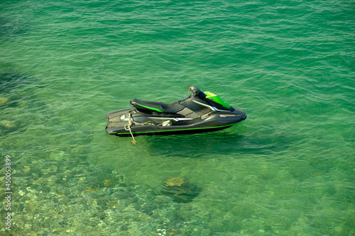 Jet ski on the background of green sea water photo