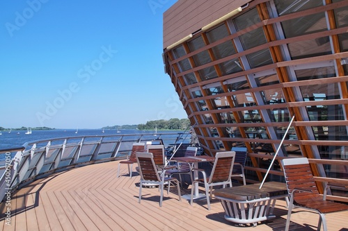 view of a fragment of a cafe on the pier and the Vistula river in Płock, Poland