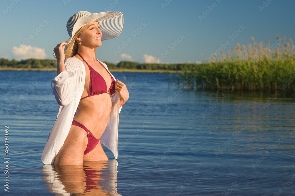 Naklejka premium Beautiful woman in bikini on the beach