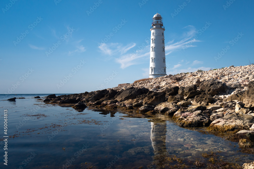 Obraz premium lighthouse on the shore of the sea