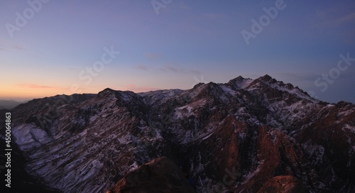 Sunrise on the mount of Sinai , Egypt . Panoramic view on Saint Catherine mountain . Snow at the mountains . 