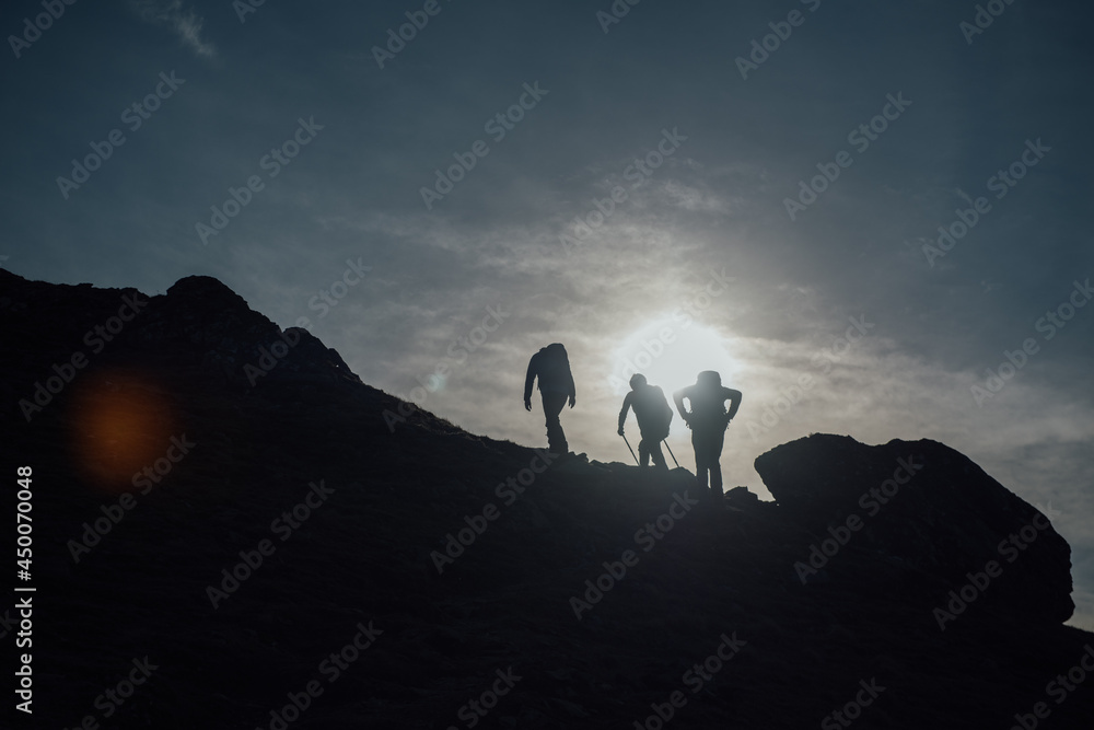 silhouette of hikers