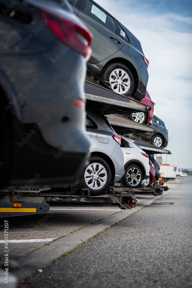road transport - transport of new cars - logistics - big trailer
