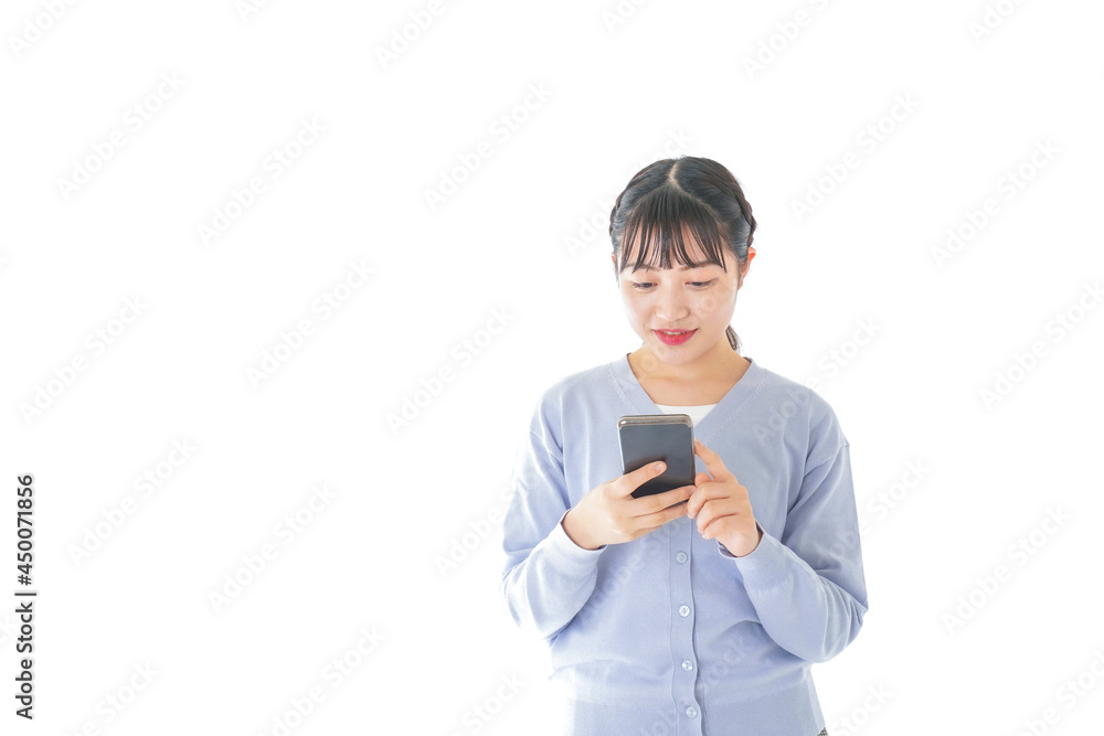 スマホを使う若い女子学生 スマホを使う若い女子学生