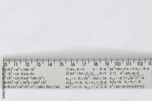 ruler with equation on the school table copy space