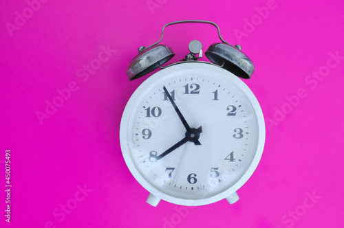 alarm clock on colorful background, hard time to start,wake up,