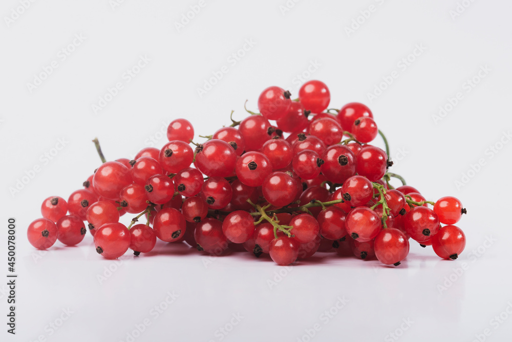 Red currant on a white isolated background. Red Ribes. Red currant on a white isolated background. Red Ribes.