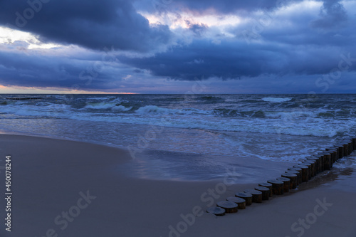 cloudy sunset over the sea, menacing sky and rough waves