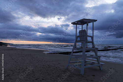 cloudy sunset over the sea and lifeguard stand © Ewelina