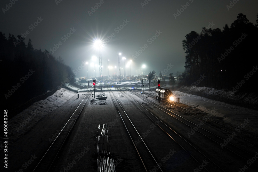 Sleeping trains in train depot at night