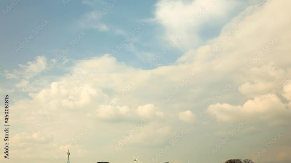 Time lapse of thick and fluffy clouds forming against a blue sky with turmoil of growing and diminishing blanket of clustering water droplets in the air making a dramatic cinematic scenery and decor