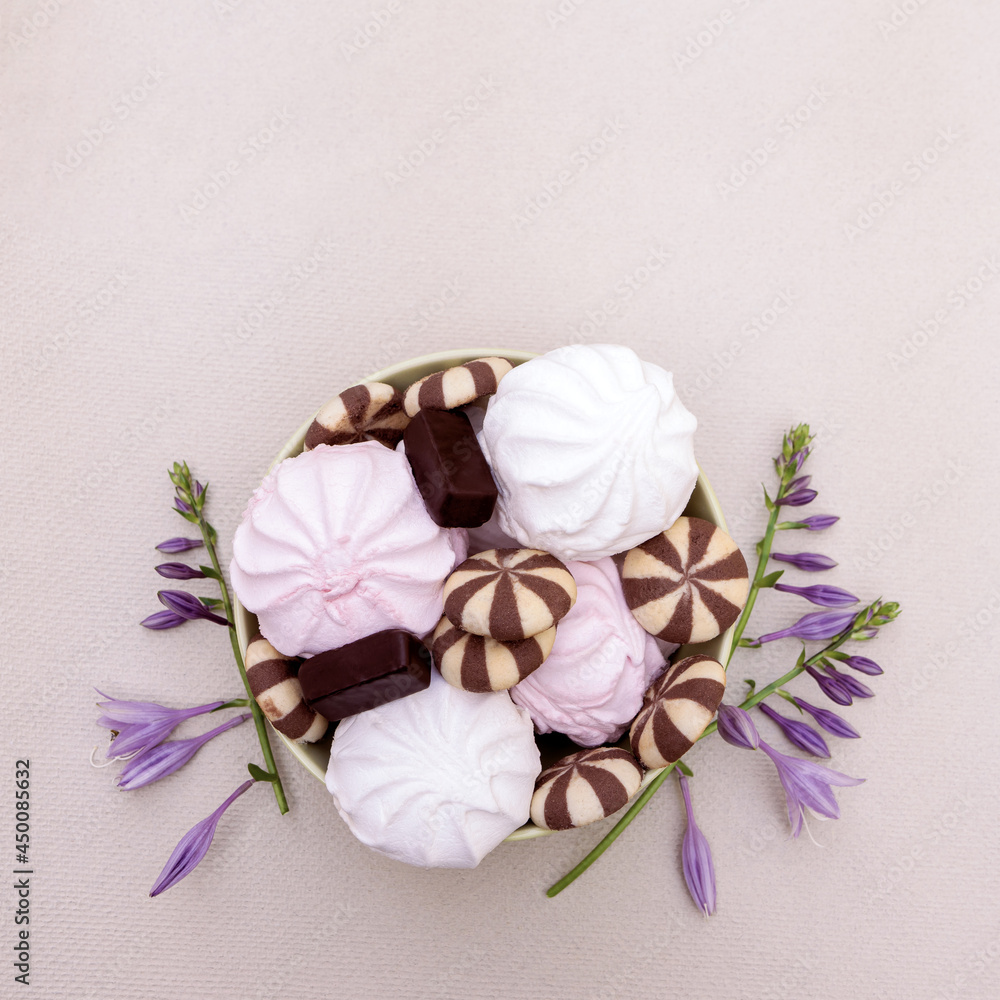 Sweet dessert made of white and pink marshmallows with cookies and chocolates. Sweet dessert made of white and pink marshmallows with cookies and chocolates.