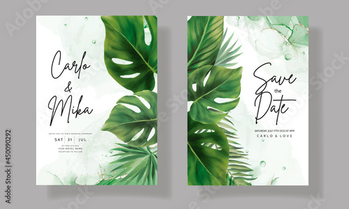 Elegant wedding invitation card with green tropical leaves watercolor