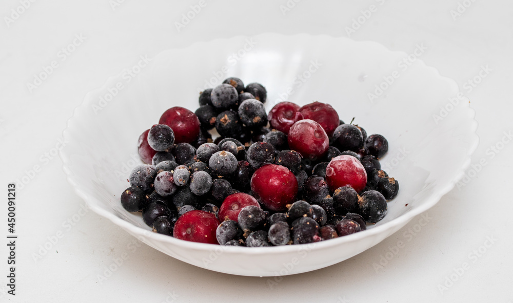 Frozen currants and cherries, close-up. Frozen currants and cherries, close-up.