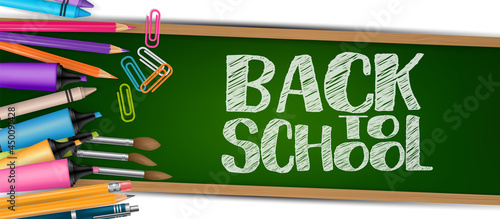 Back to school banner or header. Stationery supplies on green chalkboard background with lettering. Realistic 3d vector illustration.