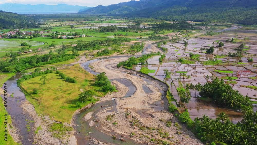 Murky Shallow River Near Quarry Area On Farmland In Southern Leyte, Philippines. - Aerial Wide Shot Murky Shallow River Near Quarry Area On Farmland In Southern Leyte, Philippines. - Aerial Wide Shot