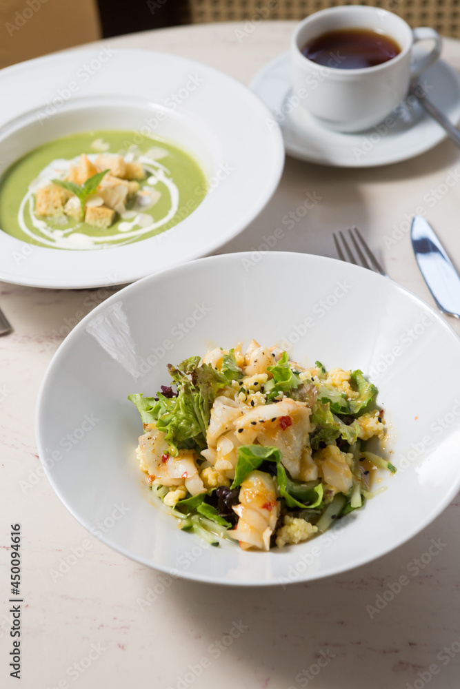 Shrimp salad on a white marble cafe table Shrimp salad on a white marble cafe table