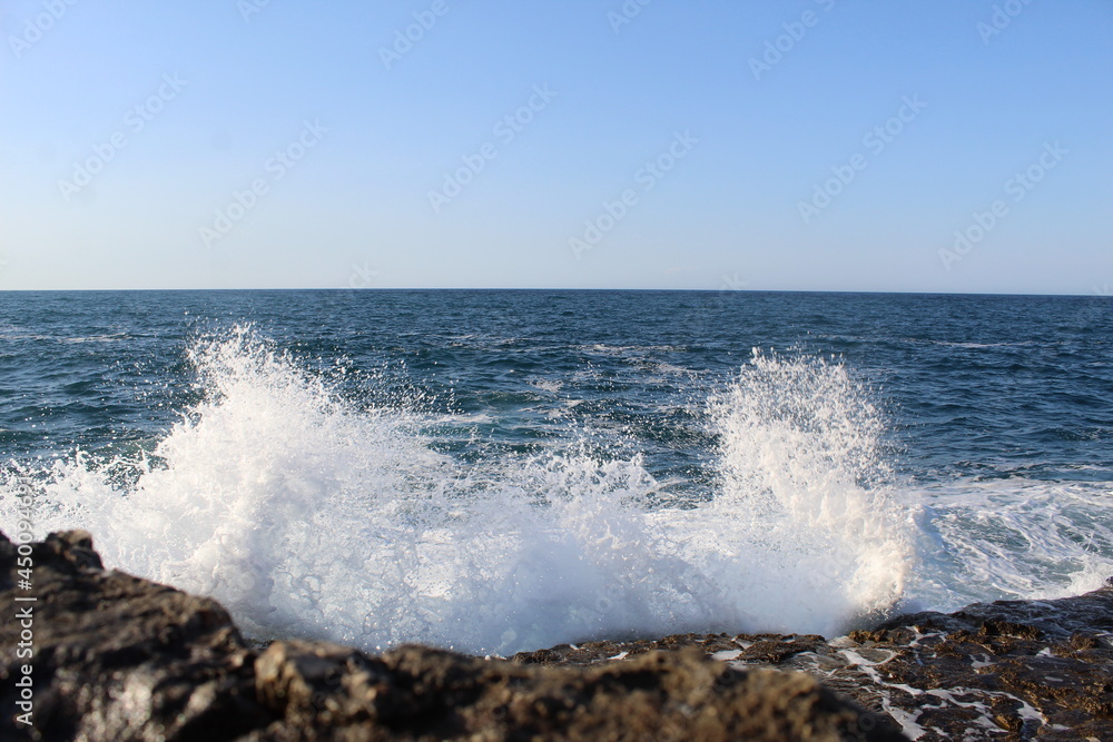 waves crashing on rocks