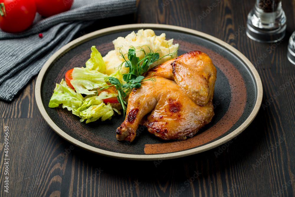 Chinese fried chicken with mashed potatoes on dark wooden table Chinese fried chicken with mashed potatoes on dark wooden table